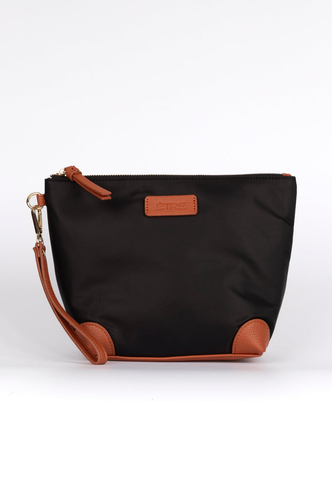 black vanity bag with tan pleater accents and detachable wrist strap