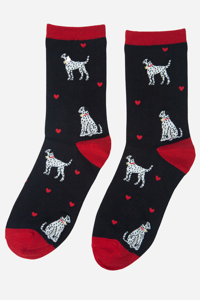 black socks with red heel, toe and trim with dalmatian dogs on them