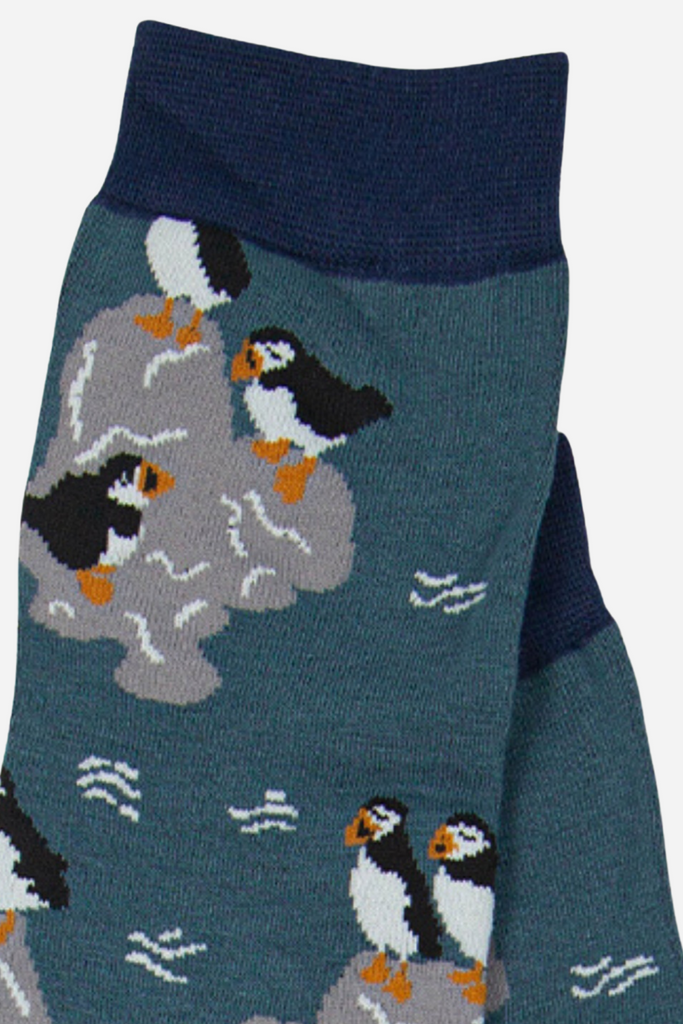 close up of the puffins on the teal bamboo socks