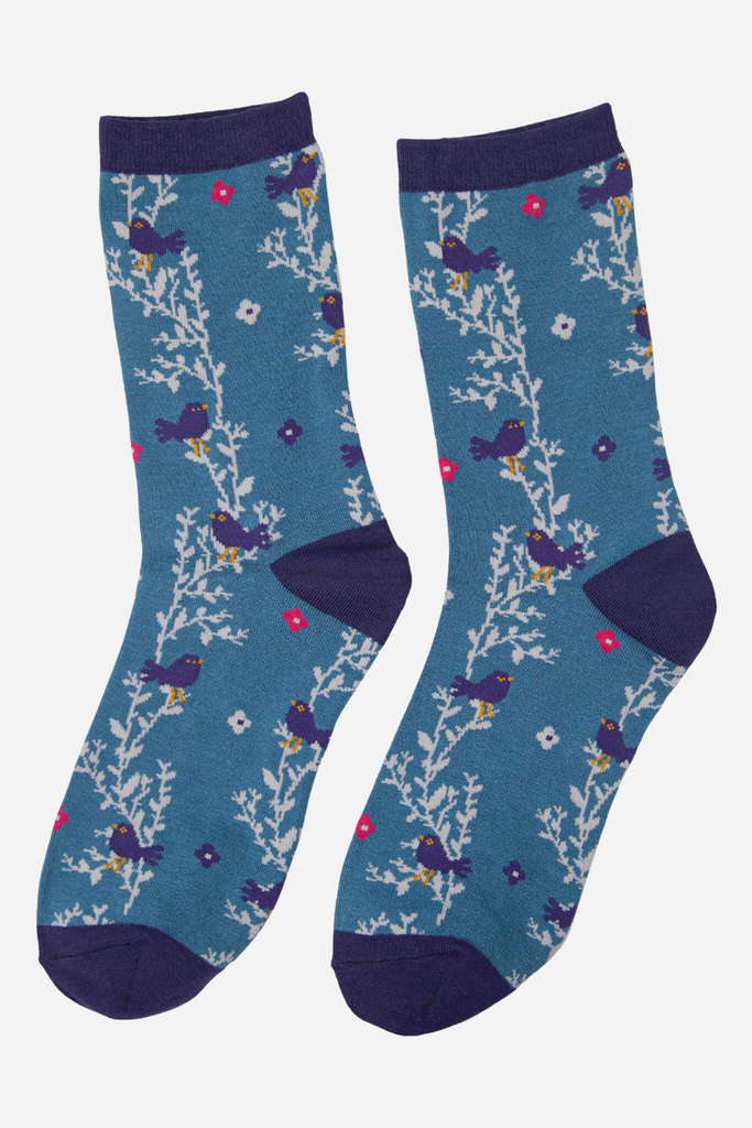 blue ankle socks with a pattern of birds, florwers and leaves