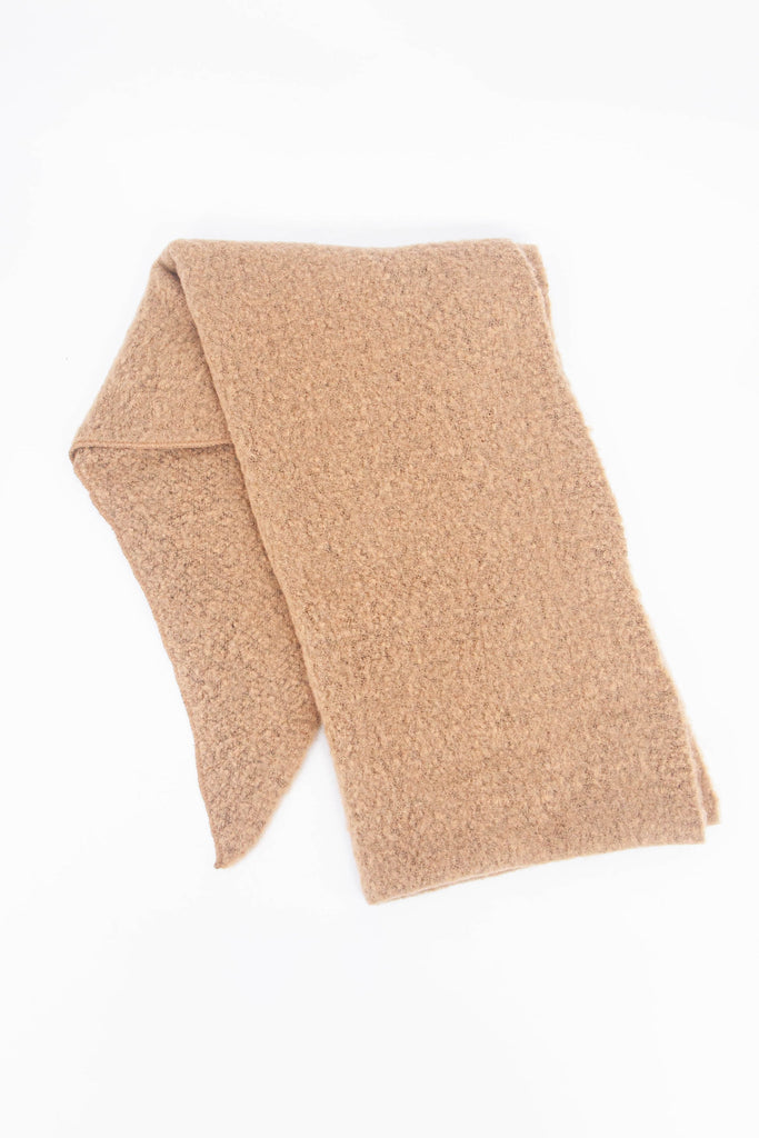 showing the scarf folded highlighting the solid plain camel colour