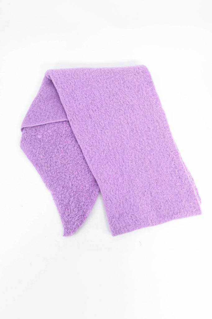 showing the scarf folded highlighting the solid pastel lilac colour