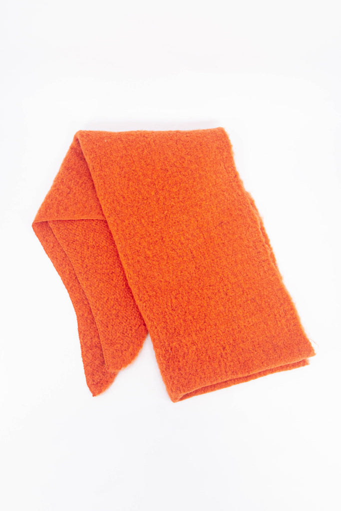 showing the scarf folded highlighting the solid plain orange colour