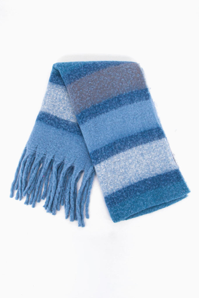 showing the scarf folded while laying flat, the striped blue colour block pattern is highlighted.