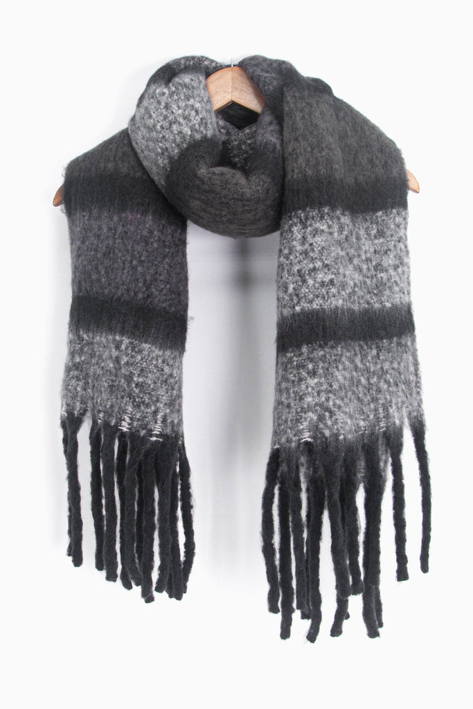 showing the grey colour block striped winter scarf draped around a coat hanger