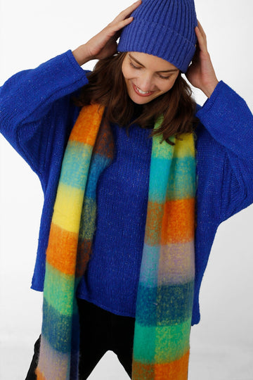 model wearing a multicoloured check pattern winter scarf 