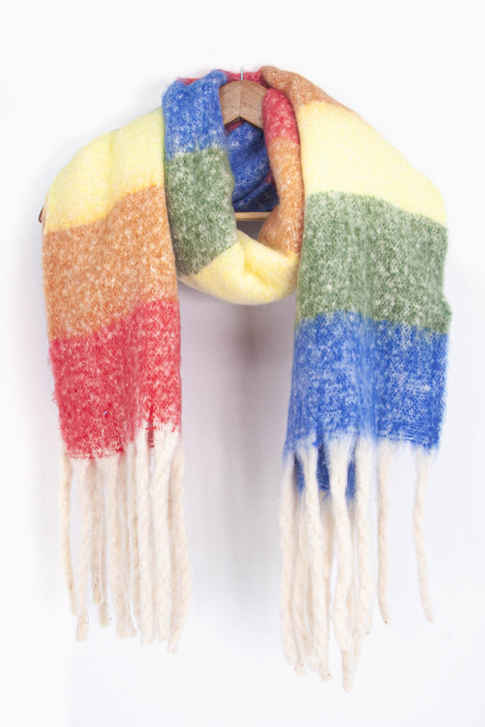 showing the multicoloured horizontal rainbow stripe winter scarf draped around a coat hanger, showing how it would look when worn.