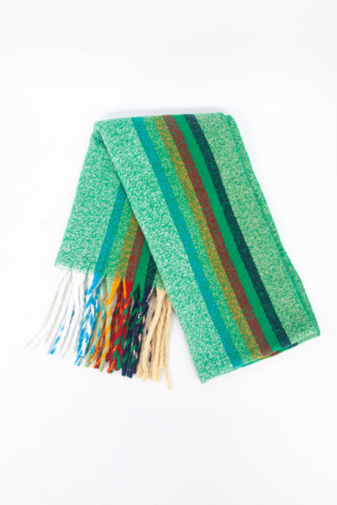 showing the scarf folded while laying flat, the green rainbow stripe pattern is highlighted. 