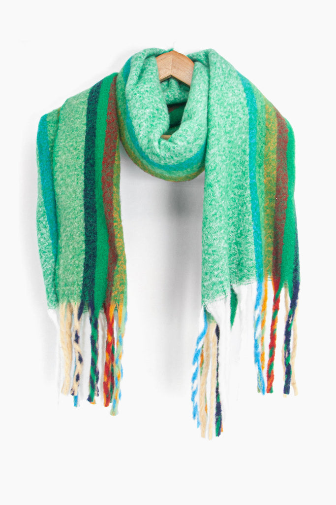 showing the multicoloured rainbow stripe winter scarf draped around a coat hanger, showing how it would look when worn.