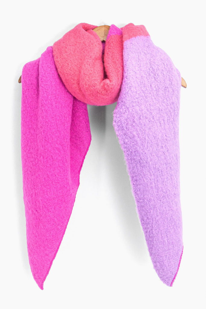 showing the pink and lilac colour block scarf draped around a coat hanger showing how it would look when worn