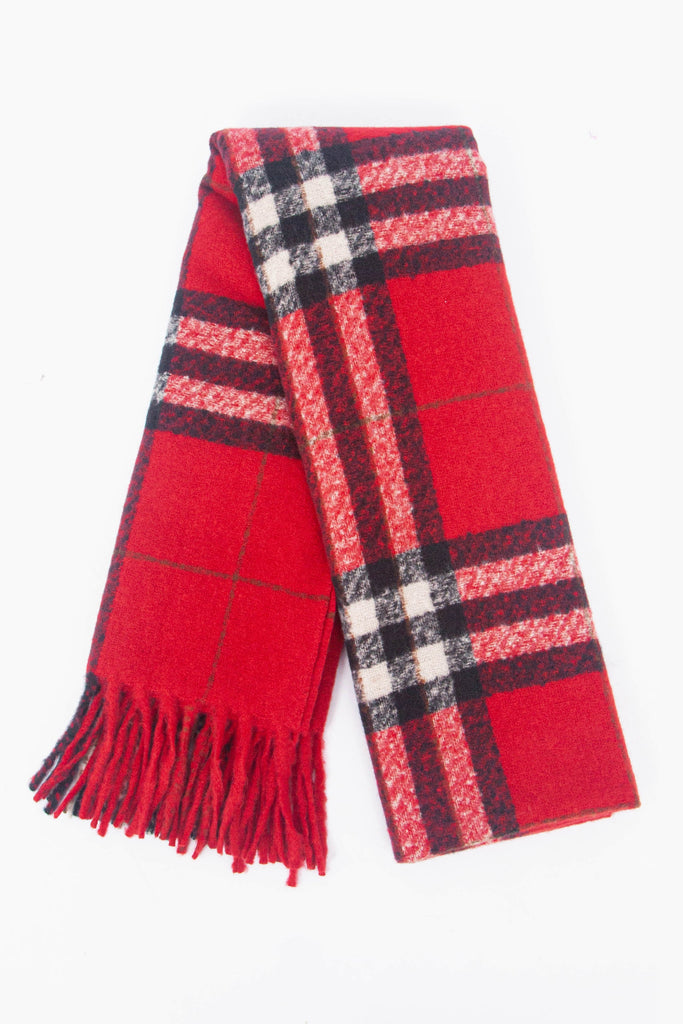 showing the scarf folded while laying flat, the traditional red check pattern is highlighted.