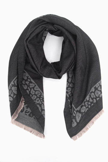 black winter scarf with a grey leopard print border and beige fringed edge