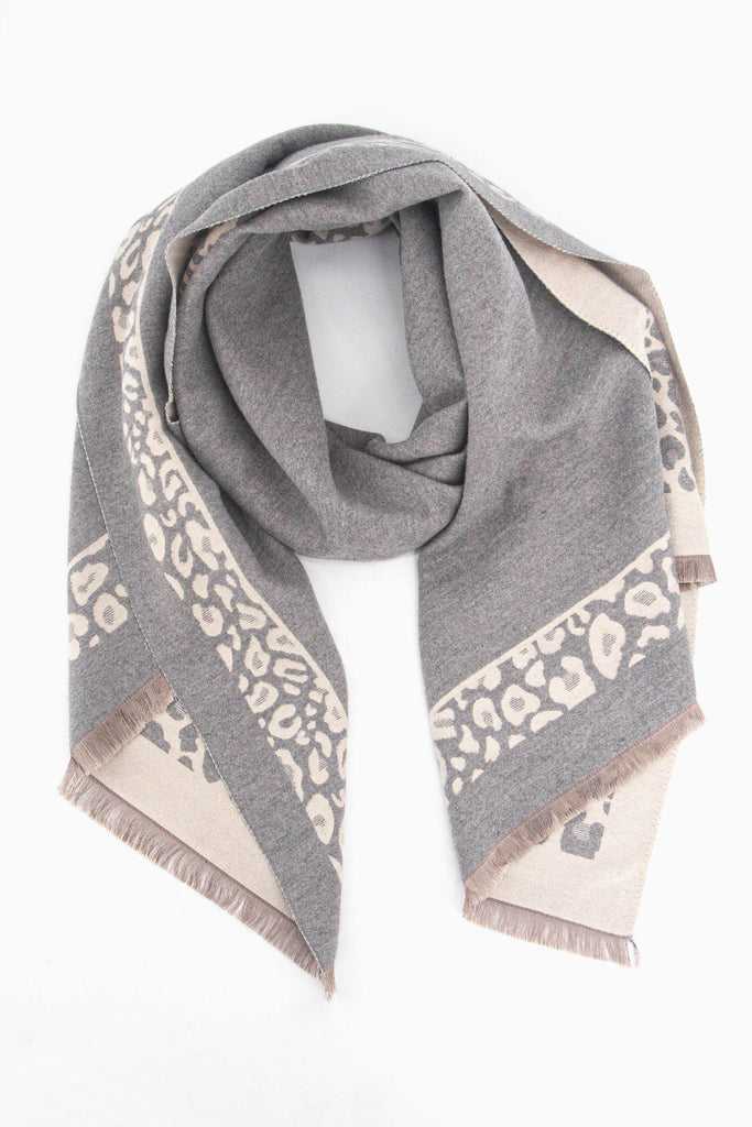 grey winter scarf with a light pink leopard print border and pink fringed edge