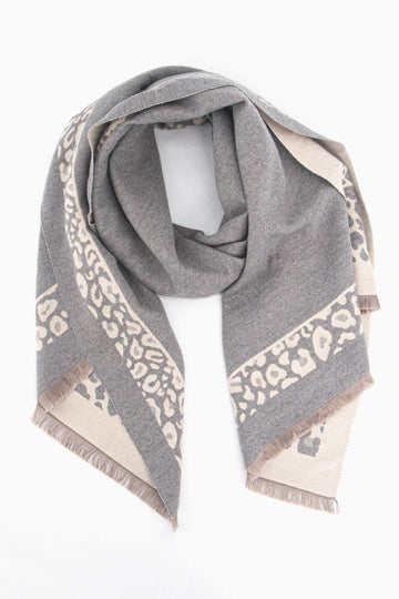 grey winter scarf with a light pink leopard print border and pink fringed edge