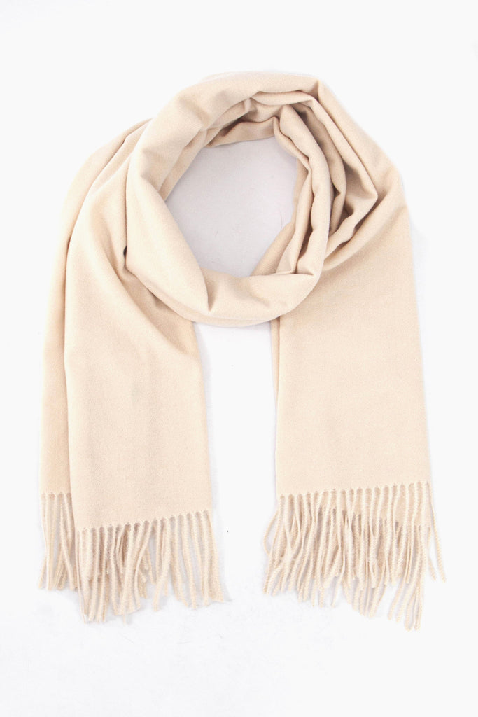 plain cream winter scarf with a tasselled fringe