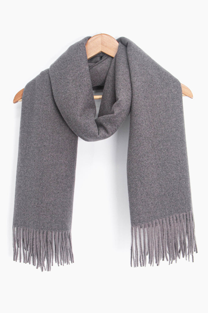 showing the grey winter scarf draped around a coat hanger