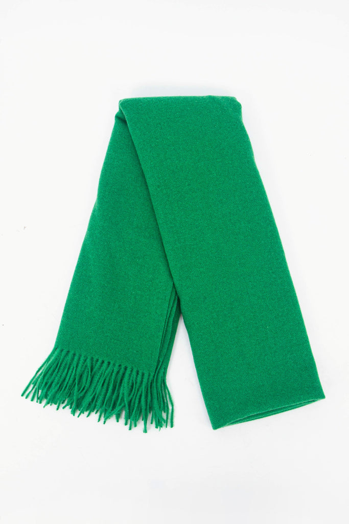 showing the scarf folded while laying flat, the plain green design is shown