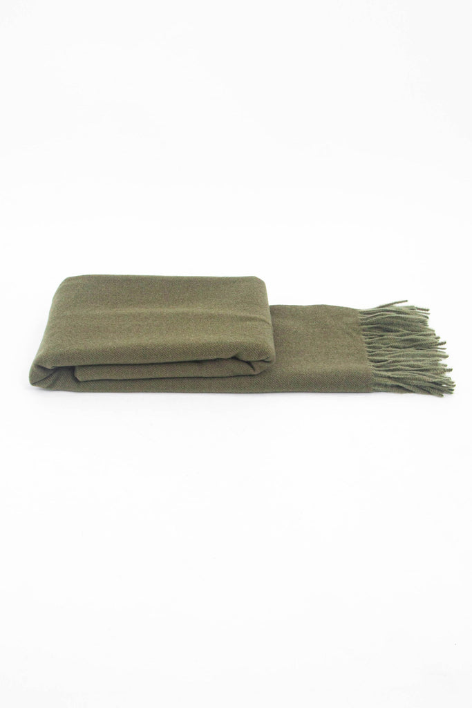 side view of the scarf when folder, showing the texture and thickness of the material. this scarf is warm and winter weight