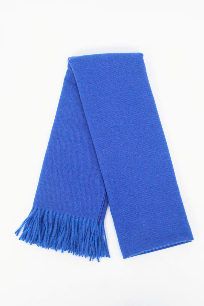 showing the scarf folded while laying flat, the plain royal blue design is shown