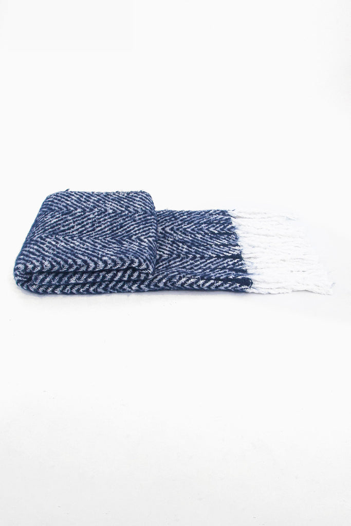 side view of the scarf when folder, showing the texture and thickness of the material. this scarf is warm and winter weight