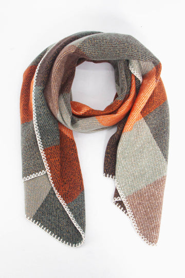 orange and green check pattern winter scarf with an all over gold sparkle and white stitched trim