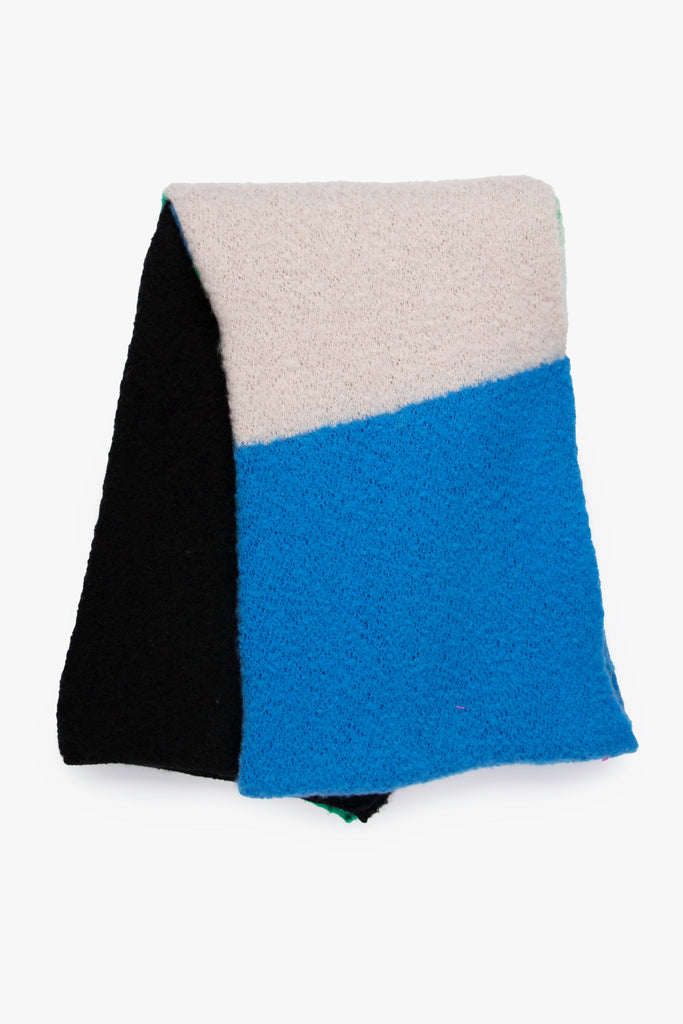 showing the scarf folded, highlighting the contrasting colour block design, the blue and cream blocks are bold and contrasting