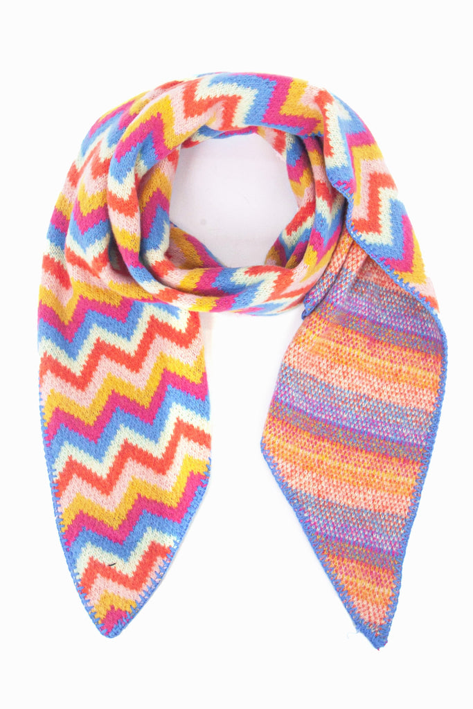 multicoloured zig zag striped asymmetric blanket scarf, the dominant colours are blue and orange, with pink and yellow stripes 