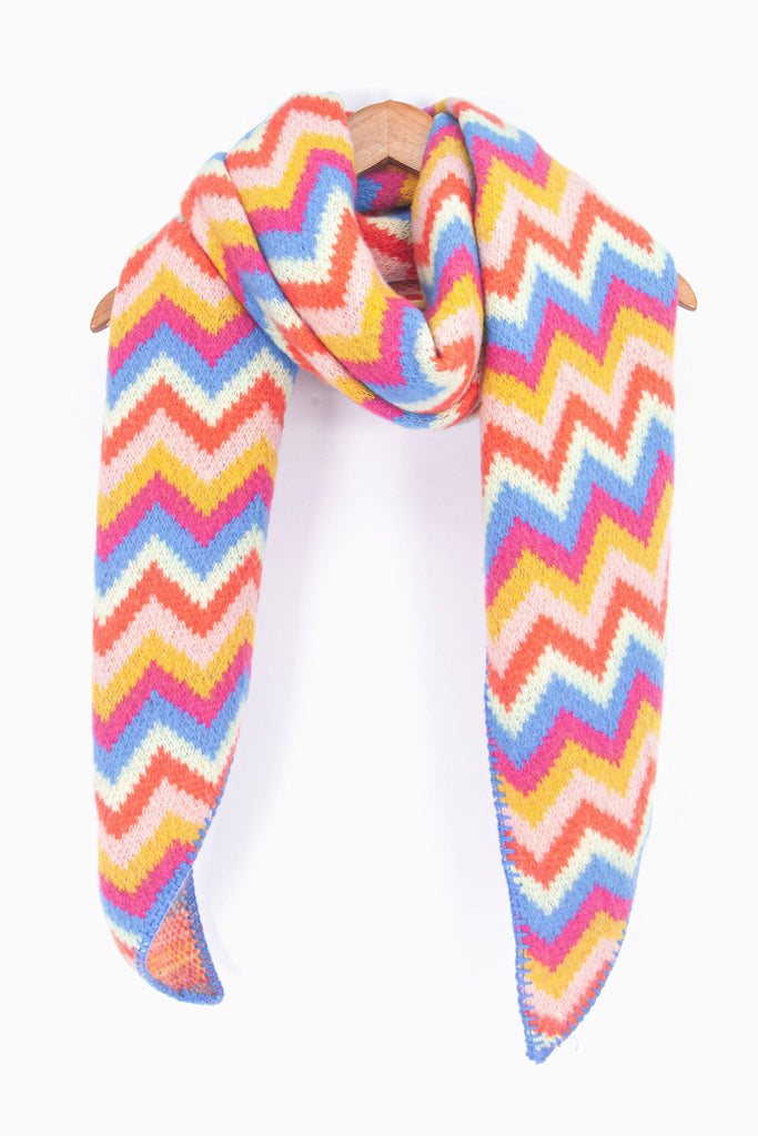 showing the multicoloured zig zag pattern winter scarf draped around a coat hanger, showing how it would look when worn.