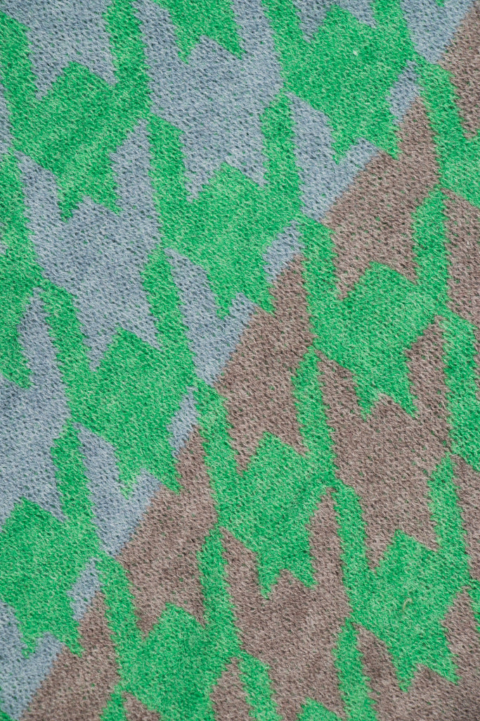 close up of the green, grey and blue houndstooth pattern on the scarf