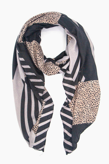 black and grey scarf in a block print pattern with striped and contrasting neutral animal print 