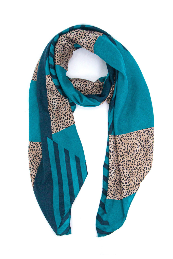 blue scarf in a block print pattern with striped and contrasting neutral animal print 