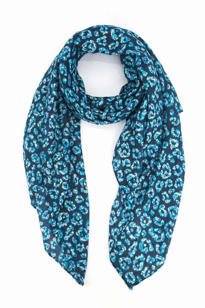 navy blue scarf with an all over light blue leopard print pattern with gold foil accents