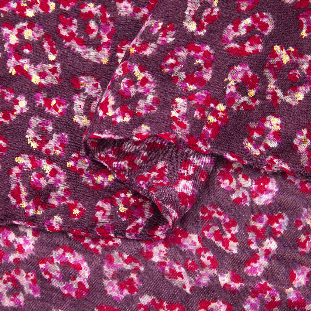 close up of the soft viscose fabric, the pink leopard print colourway is clearly visible