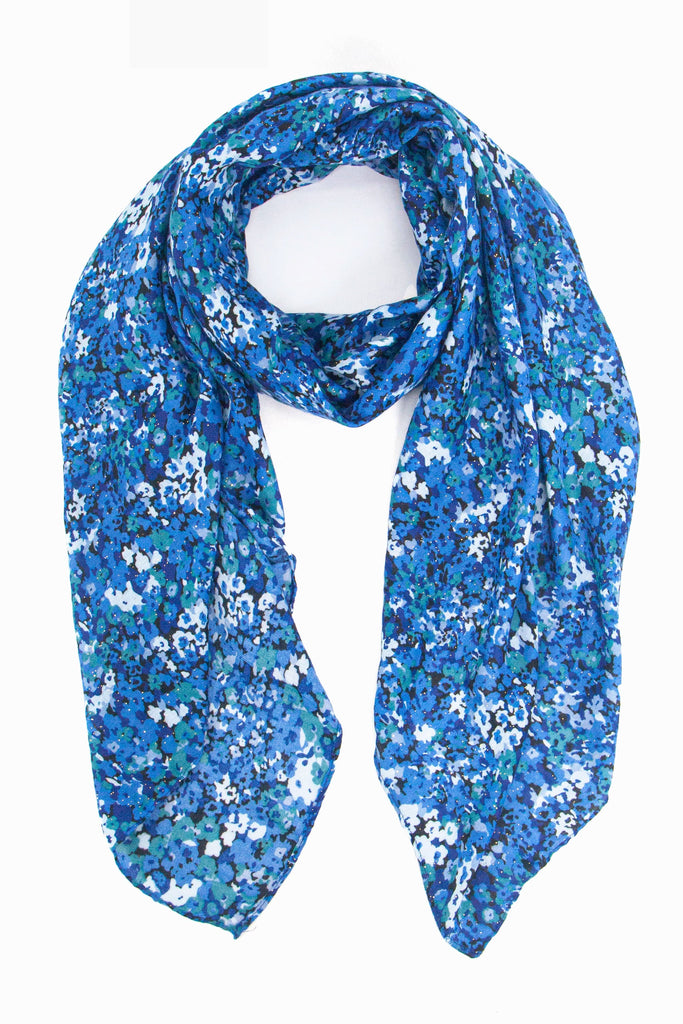 floral print lightweight scarf in blue tones, the floral pattern is small and all over the scarf