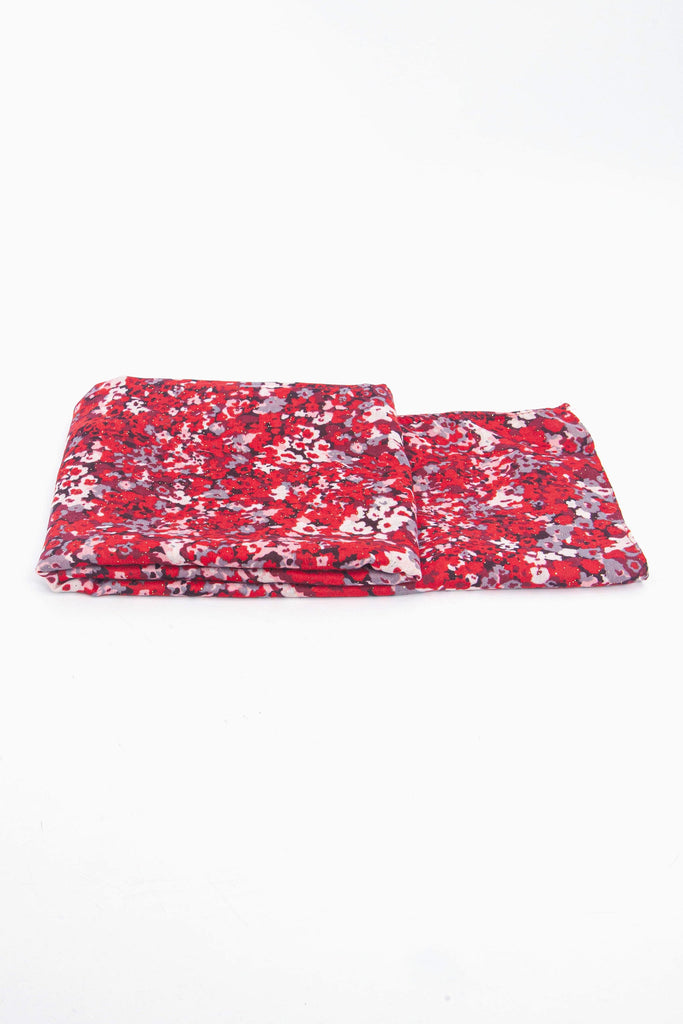 side view of the scarf when folded, showing the texture and thickness of the material. this scarf is lightweight