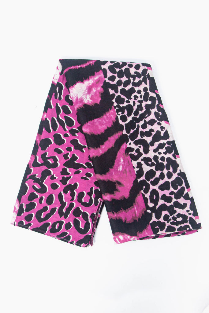 showing the scarf folded, the fuchsia ombre mixed animal print pattern is shown to cover the whole scarf