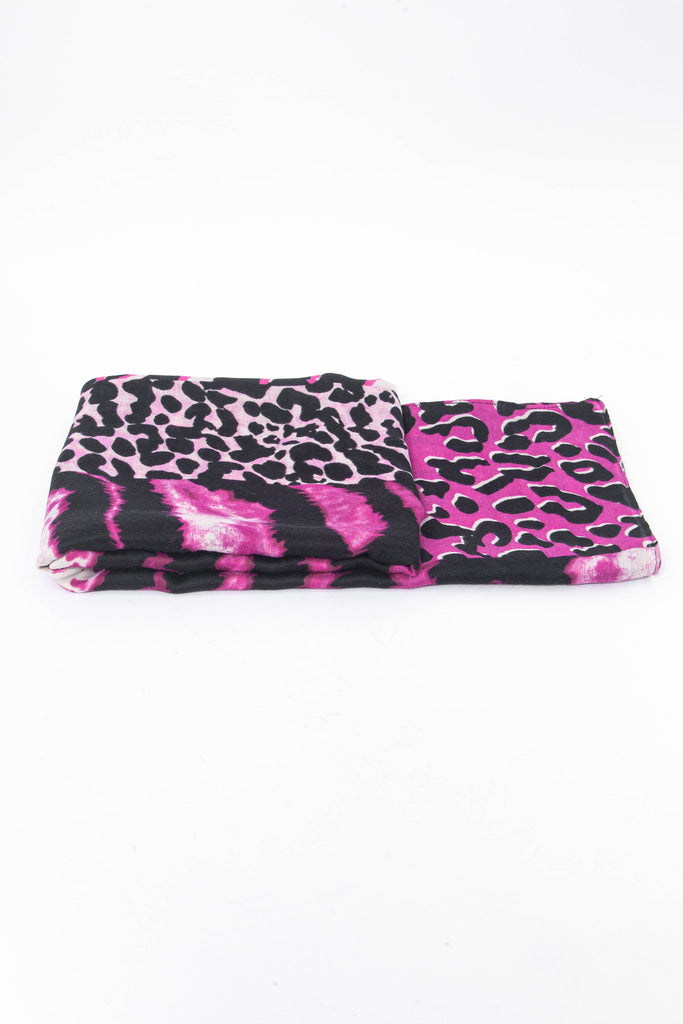 side view of the scarf when folded, showing the texture and thickness of the material. this scarf is lightweight