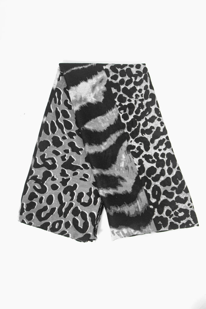 showing the scarf folded, the grey ombre mixed animal print pattern is shown to cover the whole scarf