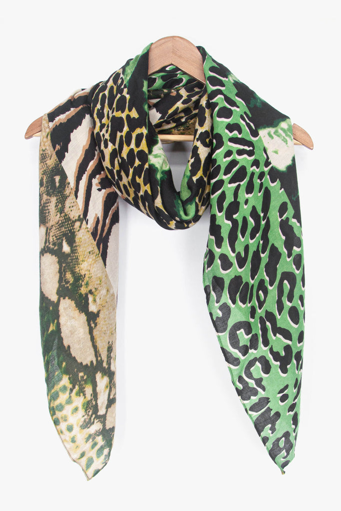 showing the scarf draped around a coat hanger, showing the all over pattern and how it would look when worn