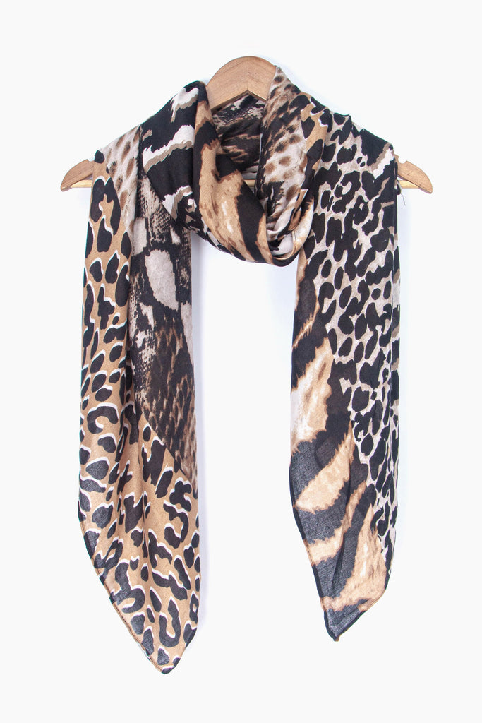 showing the scarf draped around a coat hanger, showing the all over pattern and how it would look when worn