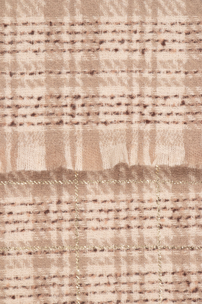 close up of the soft viscose fabric, the cream and beige check pattern is shown.