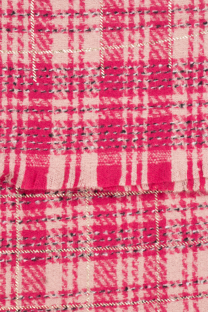 close up of the soft viscose fabric, the fuchsia and pink check pattern is shown.