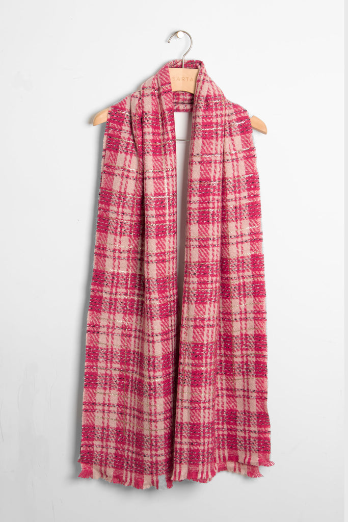showing the scarf draped around a coat hanger, showing the all over pattern and how it would look when worn