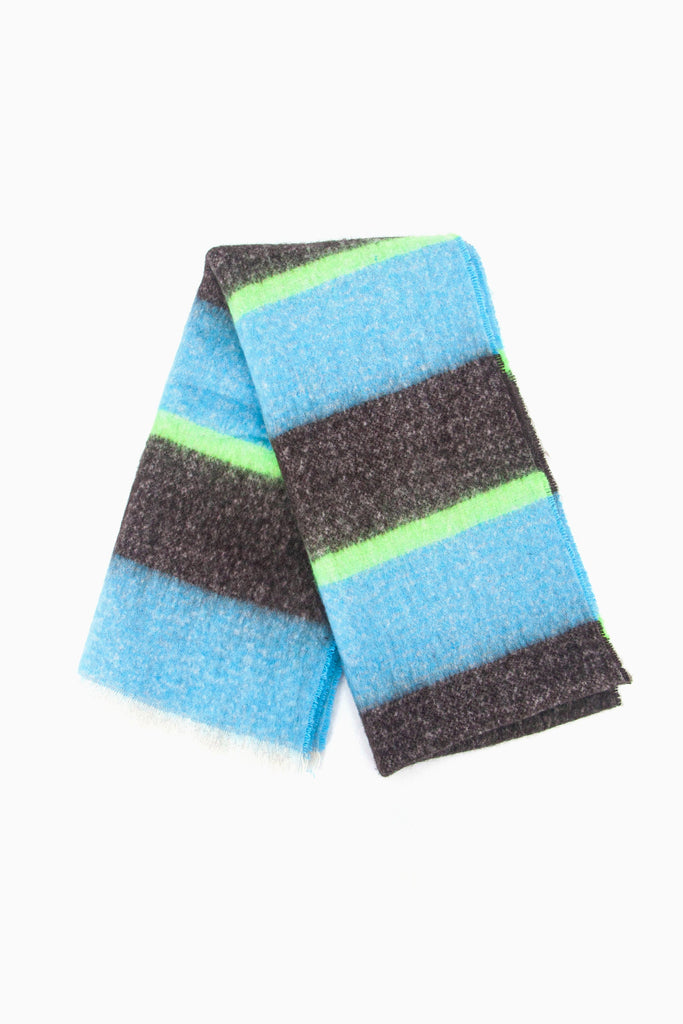 showing the scarf folded the block stripe pattern is shown to cover the whole scarf, there are thick black and blue stripes interspersed with a thin neon green stripe