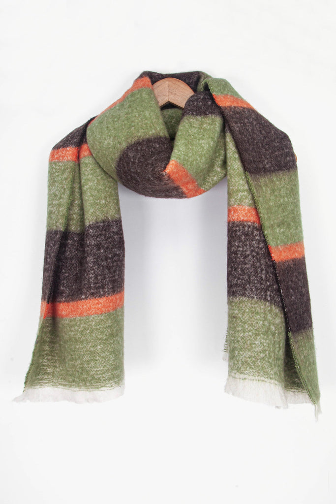 showing the scarf draped around a coat hanger, showing the all over pattern and how it would look when worn