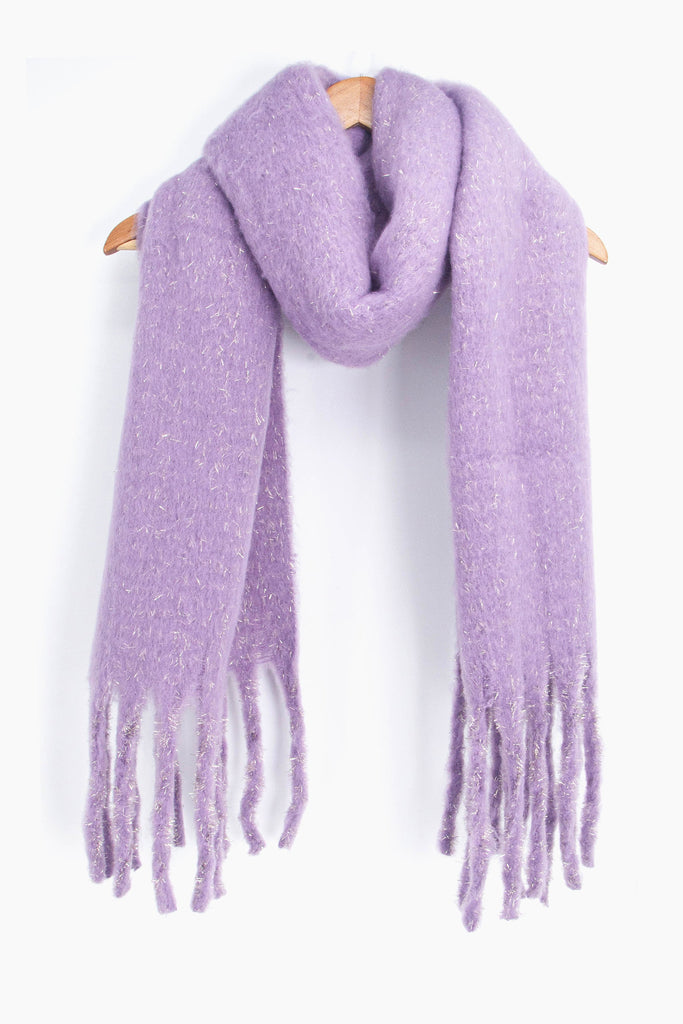 showing the lilac and silver tinsel winter scarf draped around a coat hanger, showing how it would look when worn.