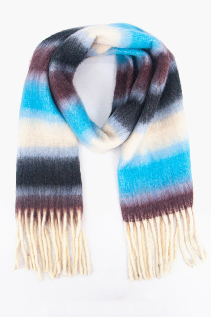 blue, cream and black striped winter scarf with white tassel trim