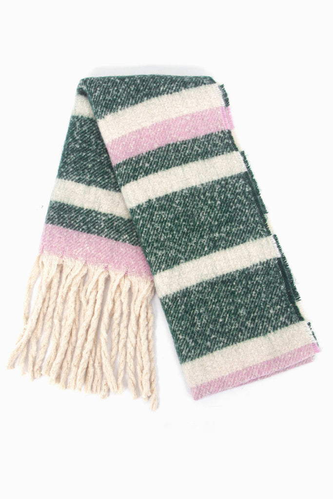 showing the scarf folded while laying flat, the green, white and pink striped pattern is highlighted as is the cream tassel fringe