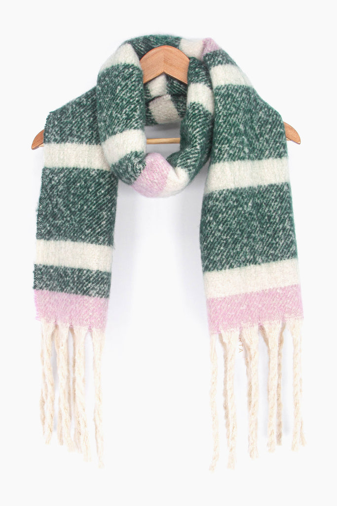 showing the green, pink and white winter scarf draped around a coat hanger, showing how it would look when worn