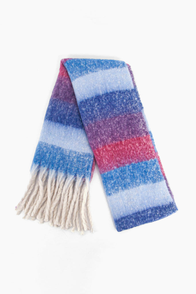 showing the scarf folded while laying flat, the colour block stripe pattern is highlighted. there are blue, pink and purple tones visible in the design.